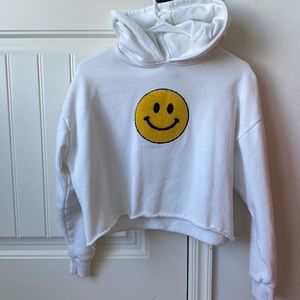 Women’s small , white Forever 21 cropped hoodie with a smiley face.